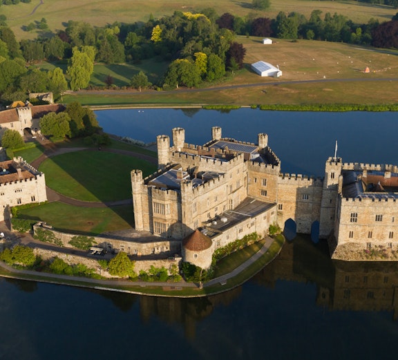 Leeds Castle with moat, Canterbury Cathedral, and Dover's White Cliffs on a London day trip.