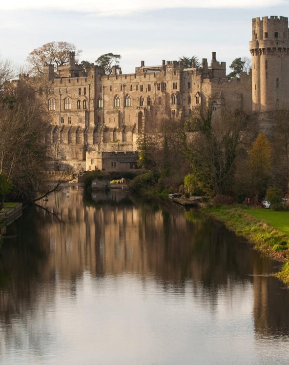 Warwick Castle with lush gardens, part of London to Warwick Tours.