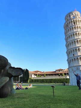 Leaning Tower of Pisa with tourists, part of Florence to Pisa tours.