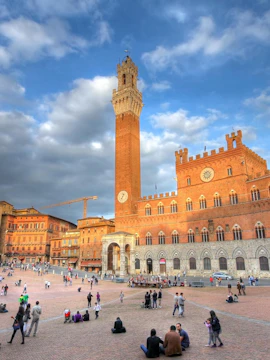 Siena's Piazza del Campo with historic buildings, part of Florence to Siena tours.