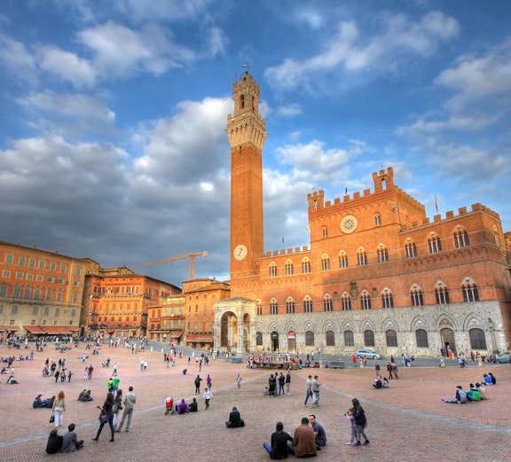 Siena's Piazza del Campo with historic buildings, part of Florence to Siena tours.
