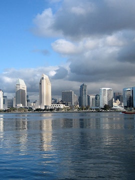 San Diego skyline with Coronado Bridge and waterfront attractions.