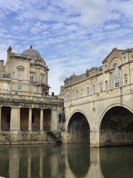 London to Bath tour featuring the Roman Baths with visitors exploring the historic site.
