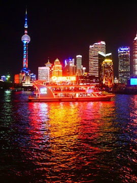Huangpu River cruise with Shanghai skyline, including Oriental Pearl Tower.