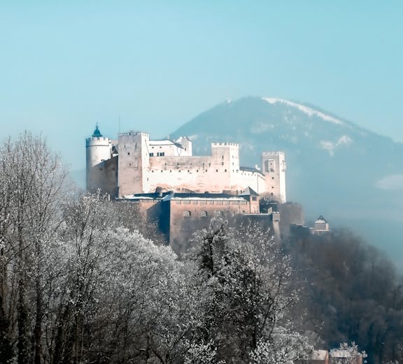 Salzburg cityscape with Hohensalzburg Fortress, viewed from Munich to Salzburg tour.