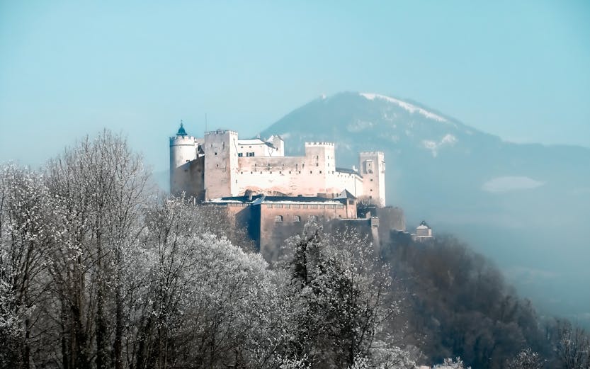 Salzburg cityscape with Hohensalzburg Fortress, viewed from Munich to Salzburg tour.