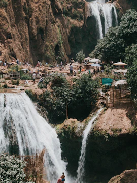Ouzoud Waterfalls cascading in lush landscape, part of Marrakech to Ouzoud Waterfalls tours.
