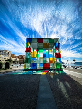 Centre Pompidou Málaga exterior with colorful glass cube in Málaga, Spain.