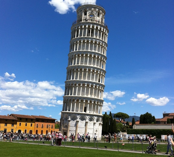 Leaning Tower of Pisa with tourists, part of Florence to Pisa tour.