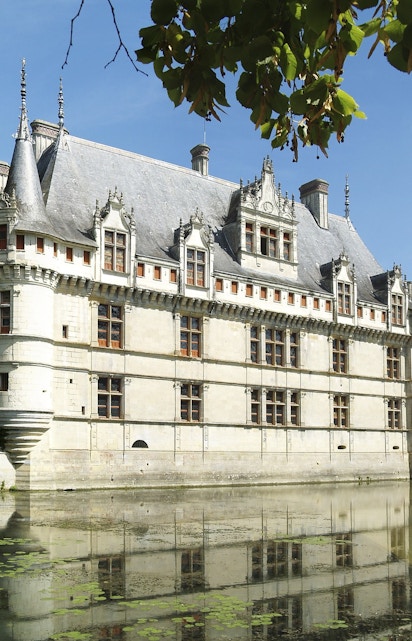 Château d'Azay-le-Rideau in Loire Valley with surrounding gardens and moat.