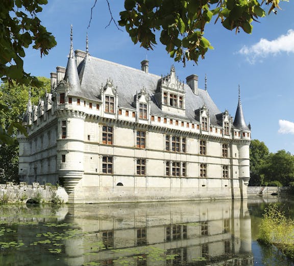 Château d'Azay-le-Rideau in Loire Valley with surrounding gardens and moat.