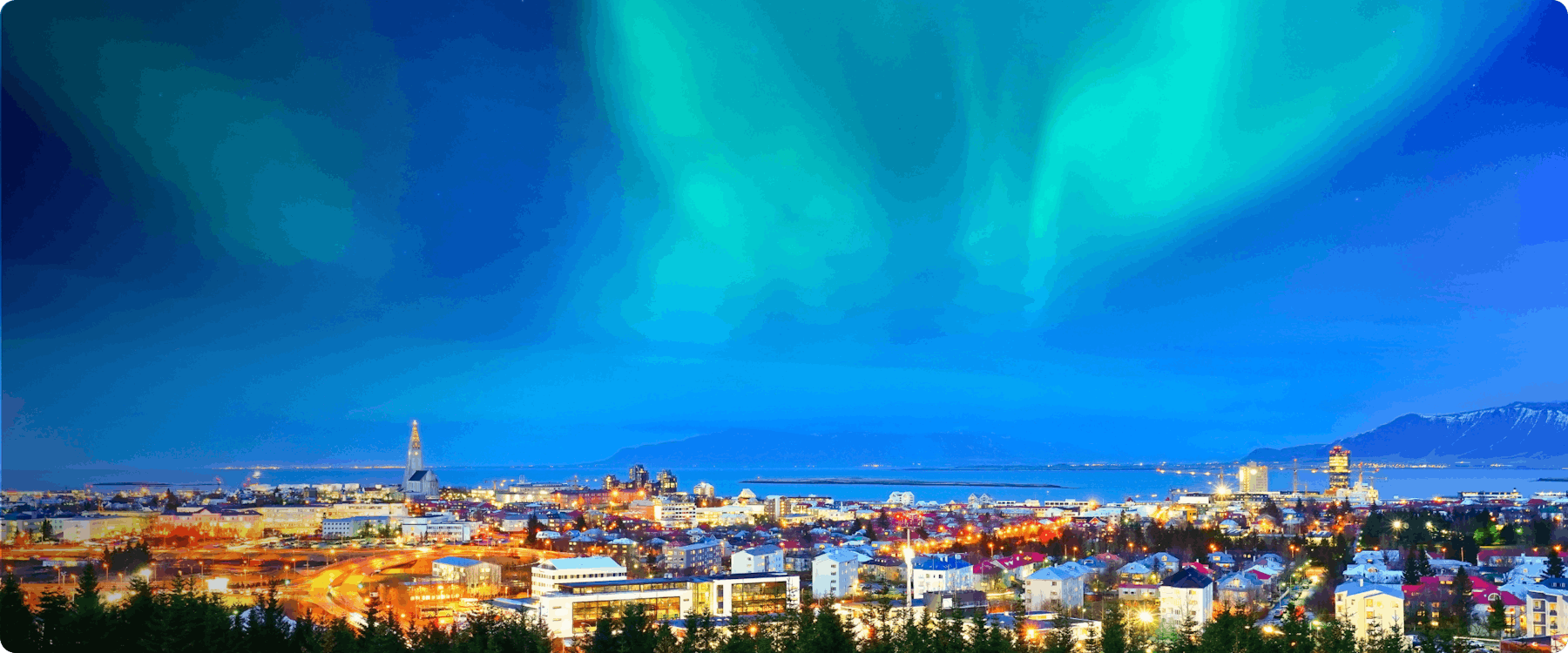 Northern lights over Reykjavik cityscape, Iceland.