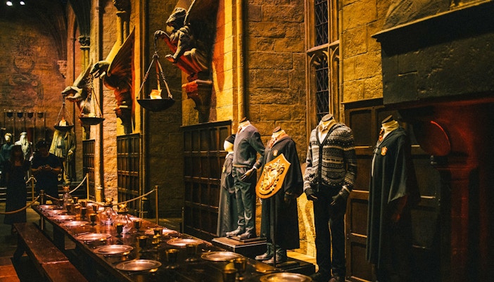 Great Hall set at Harry Potter Studio, featuring long tables and iconic floating candles.