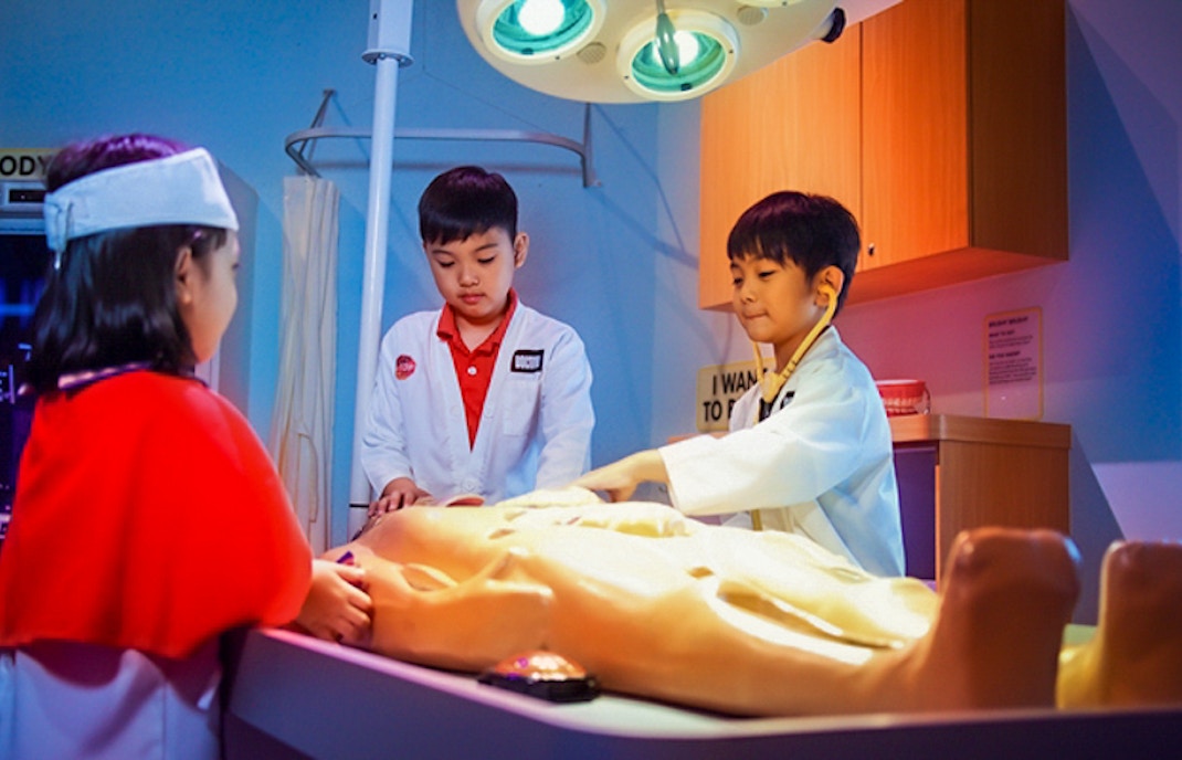 Children exploring interactive human body exhibit