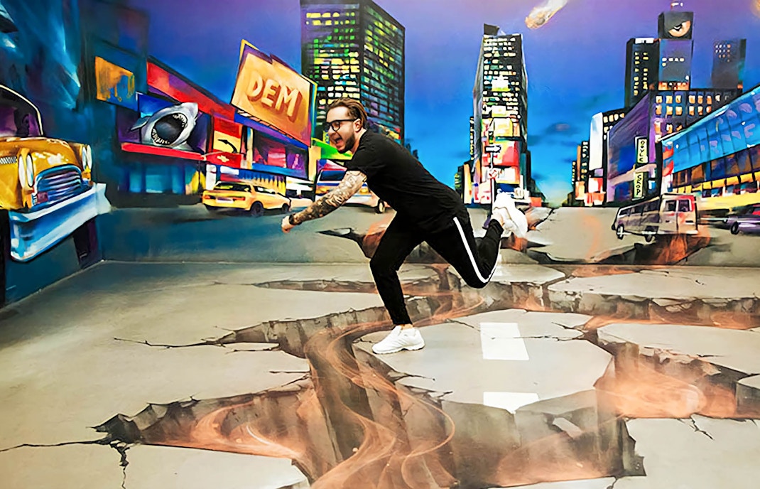 Visitors exploring interactive exhibits at Museum of Illusions Dubai.