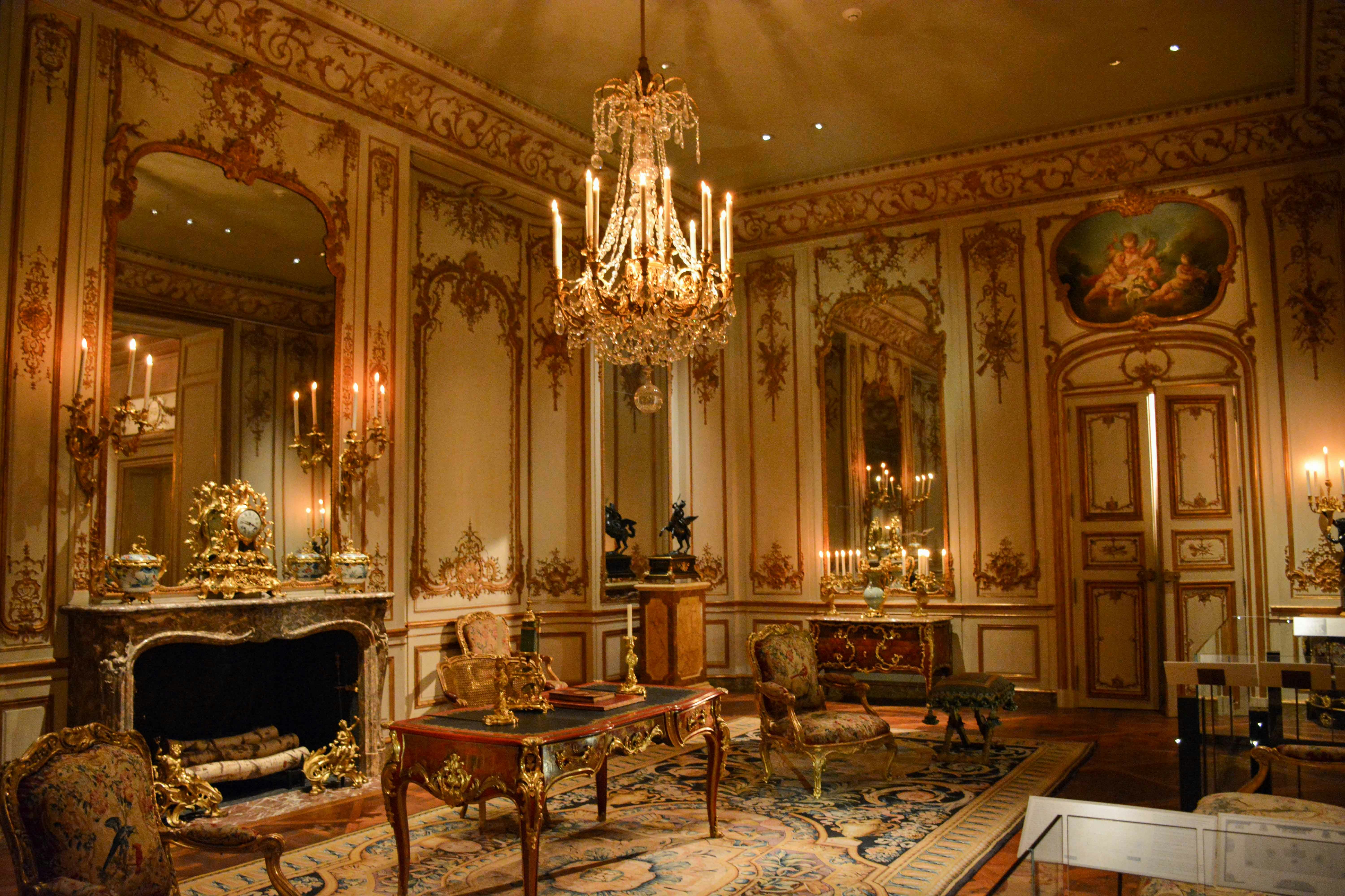 Ornate room with chandelier and antique furniture