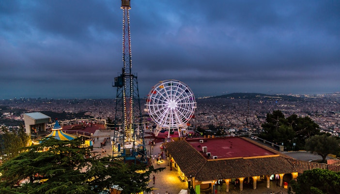 Tibidabo Amusement Park rides with panoramic views of Barcelona in October.
