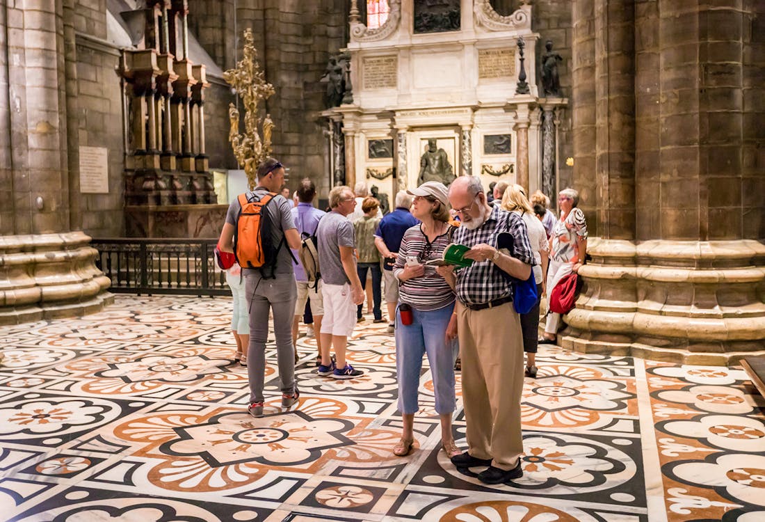 Accademia Gallery entrance in Florence with visitors waiting for a guided tour.