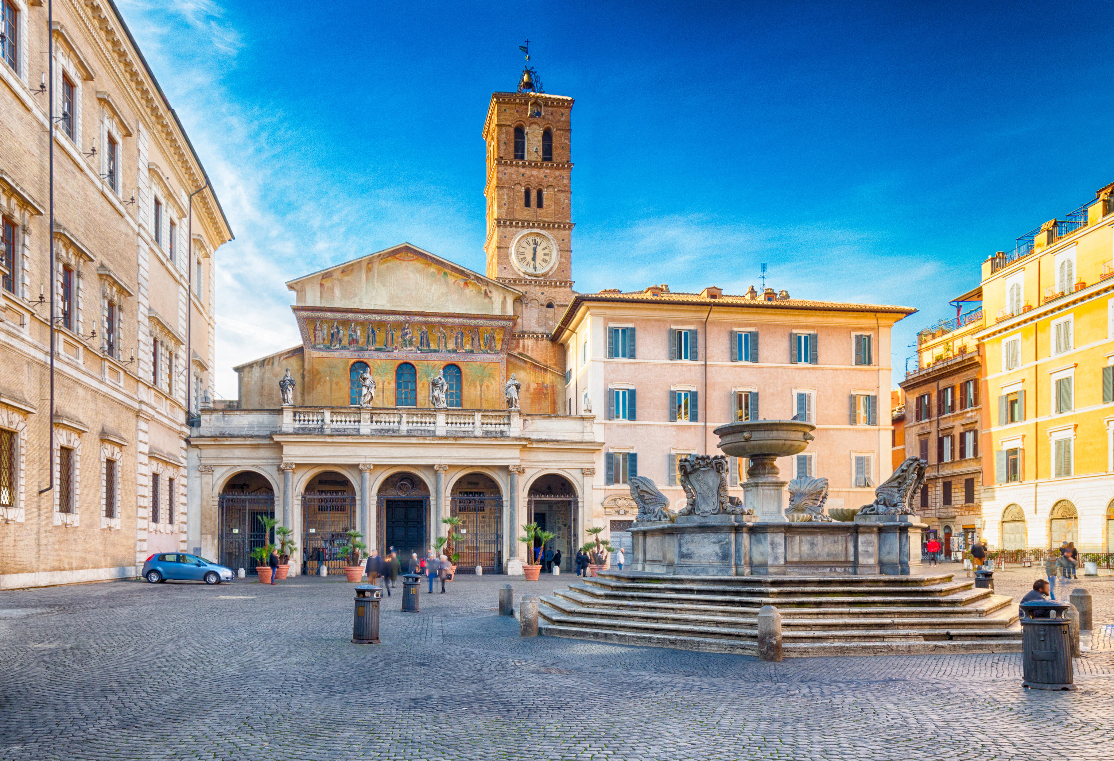 Santa Maria in Trastevere church and fountain in Rome's Trastevere district.