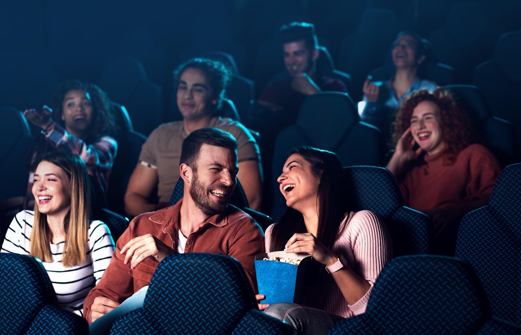Audience watching presentations on big screen in Paris Aquarium