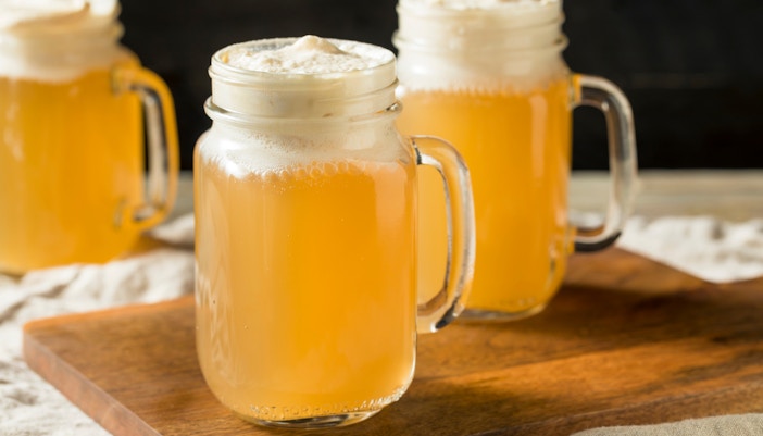 Hogwarts-themed butterbeer served in a frothy mug at Universal Studios, Orlando.