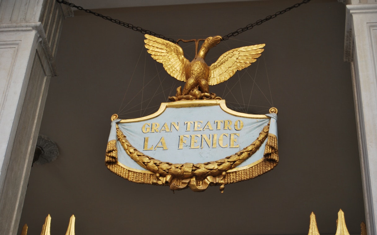 Gran Teatro La Fenice sign with golden eagle in Venice, Italy.
