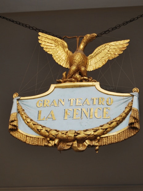 Gran Teatro La Fenice sign with golden eagle in Venice, Italy.