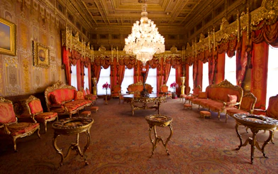 Dolmabahce Palace interior with ornate gold furniture and grand chandelier.