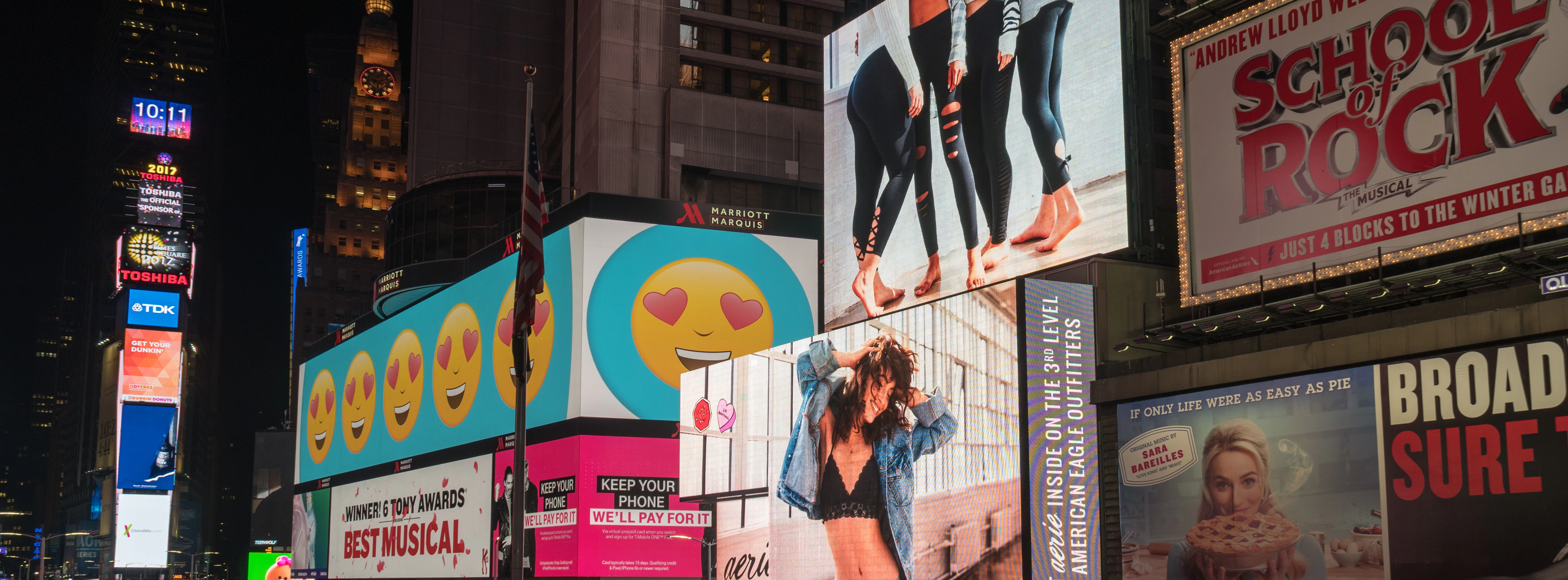 Times Square billboards featuring Broadway musical ads, New York City.