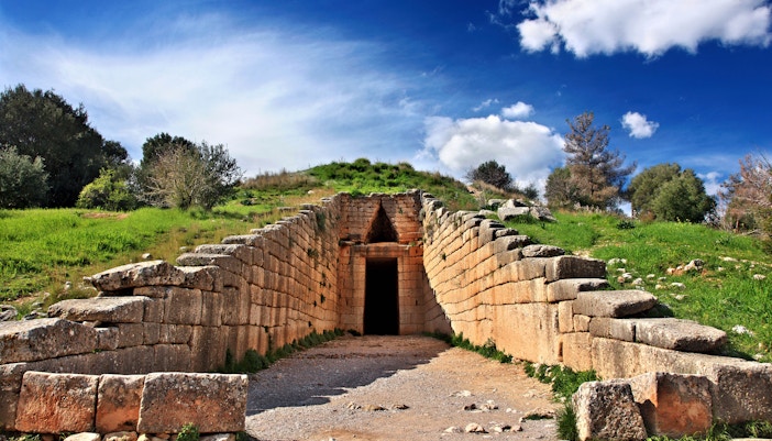 Ancient ruins of Mycenae with stone walls and archaeological site in Greece.