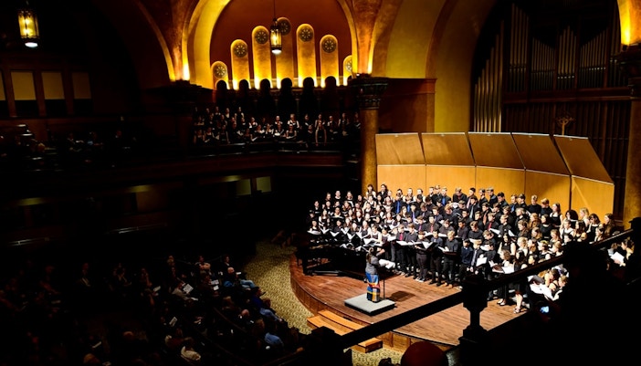 Choir performing in a grand Amsterdam concert hall in January.