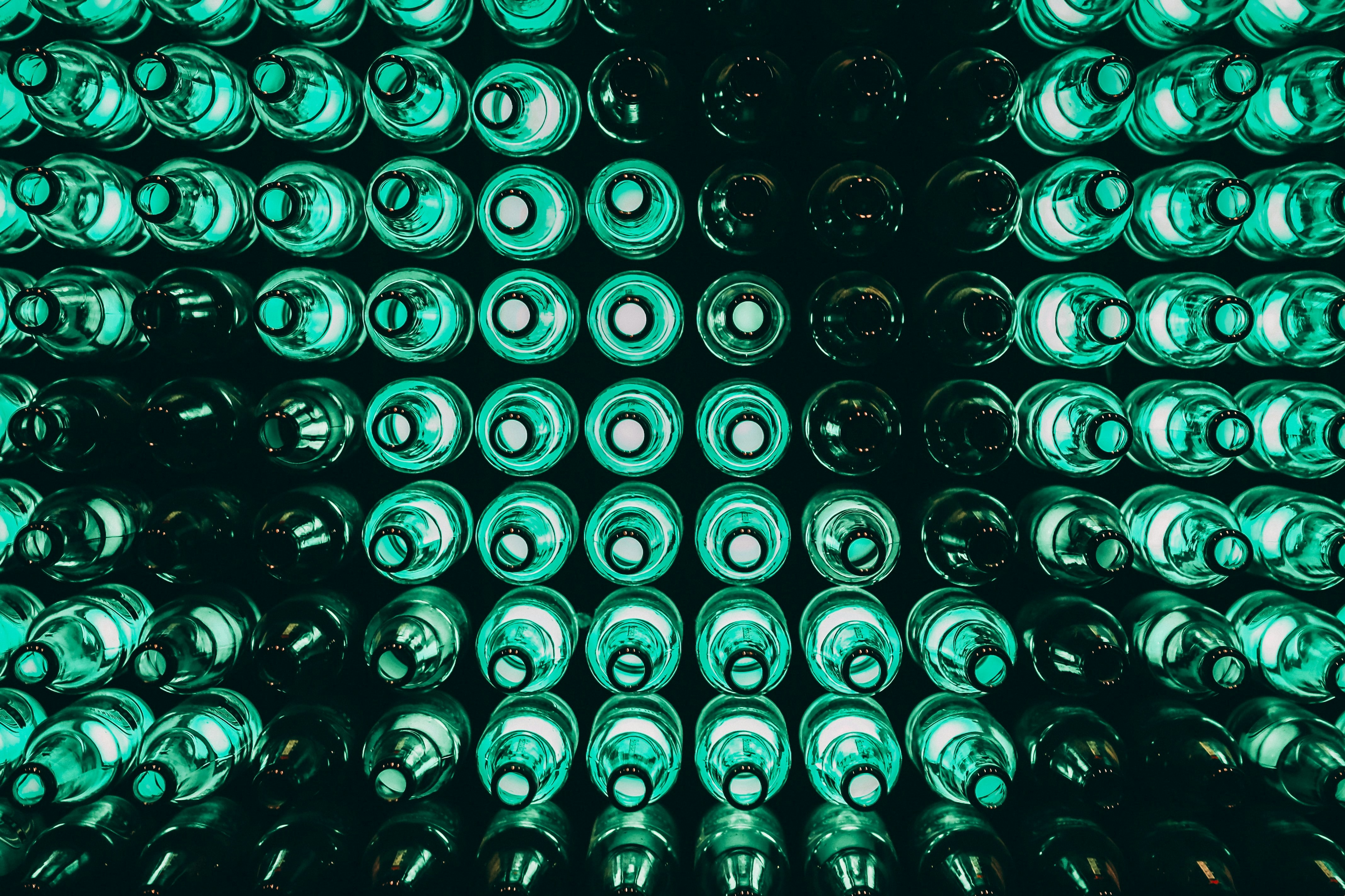 Rows of green glass bottles at the Heineken Experience in Amsterdam.