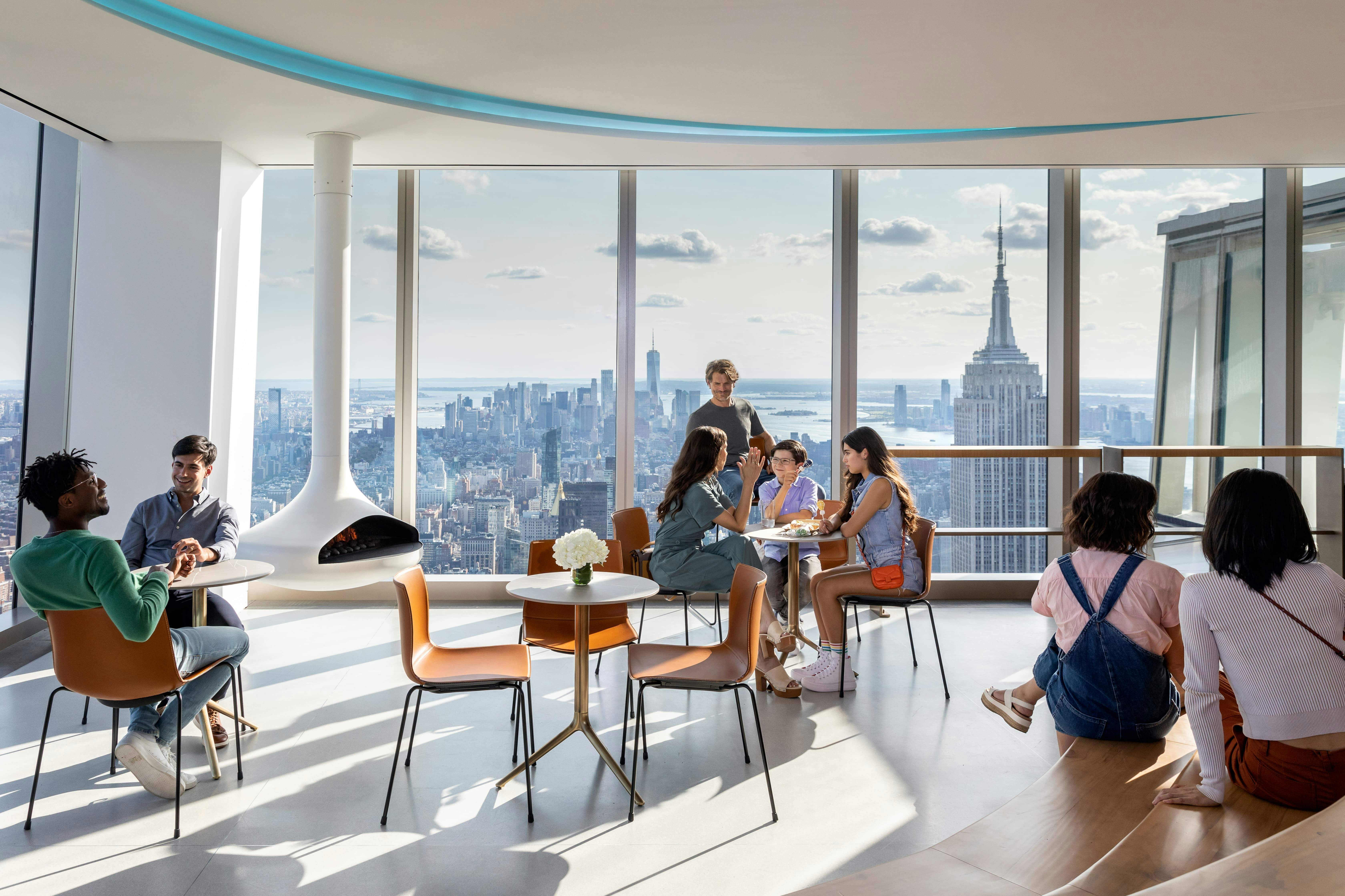 Visitors enjoying the view from Summit One Vanderbilt observation deck in New York City.