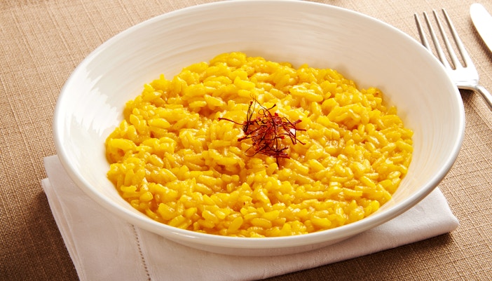 Risotto alla Milanese dish served in a restaurant in Milan during September.