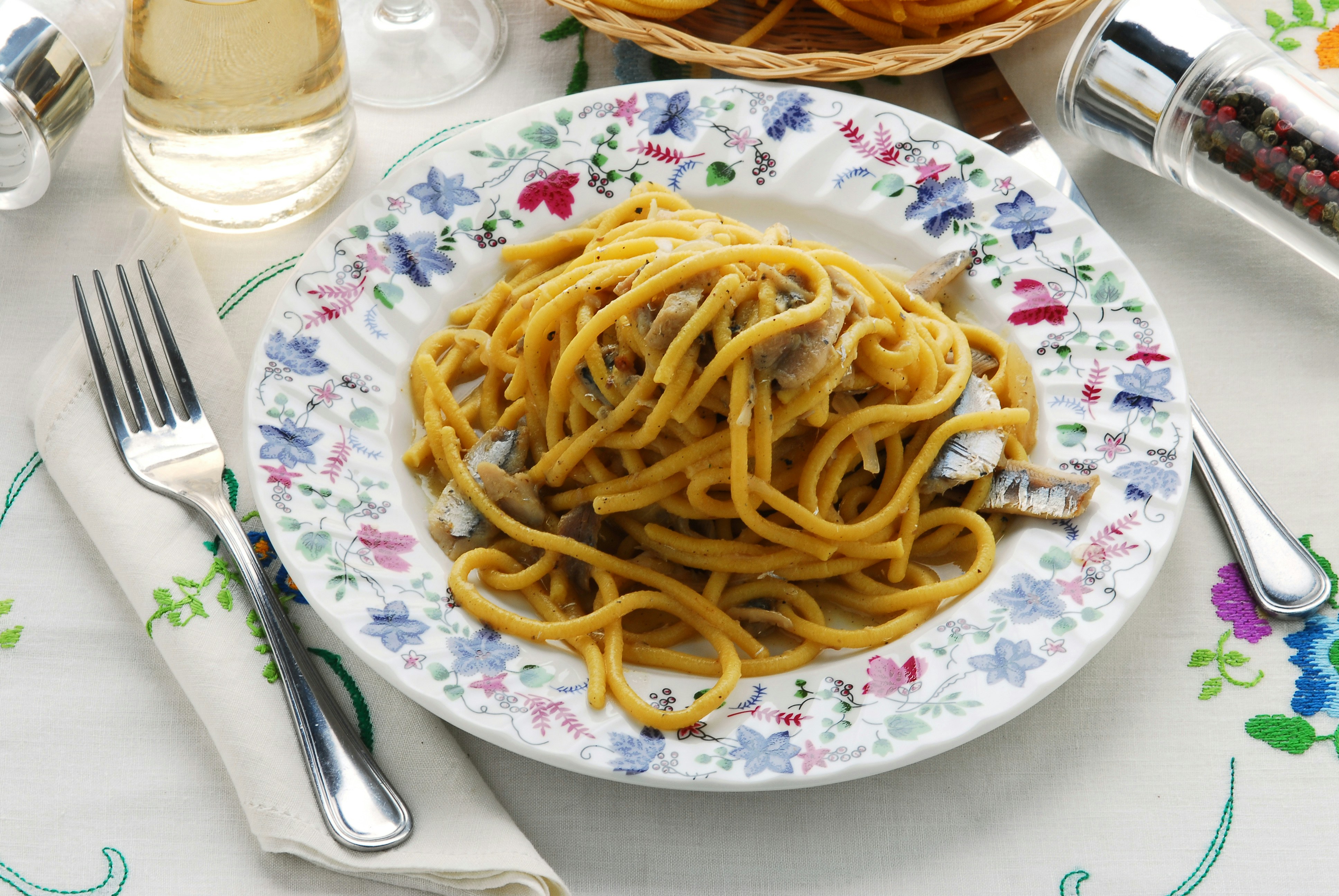 Bigoli in salsa dish served in a Venetian restaurant, highlighting Venice's culinary experience in September.