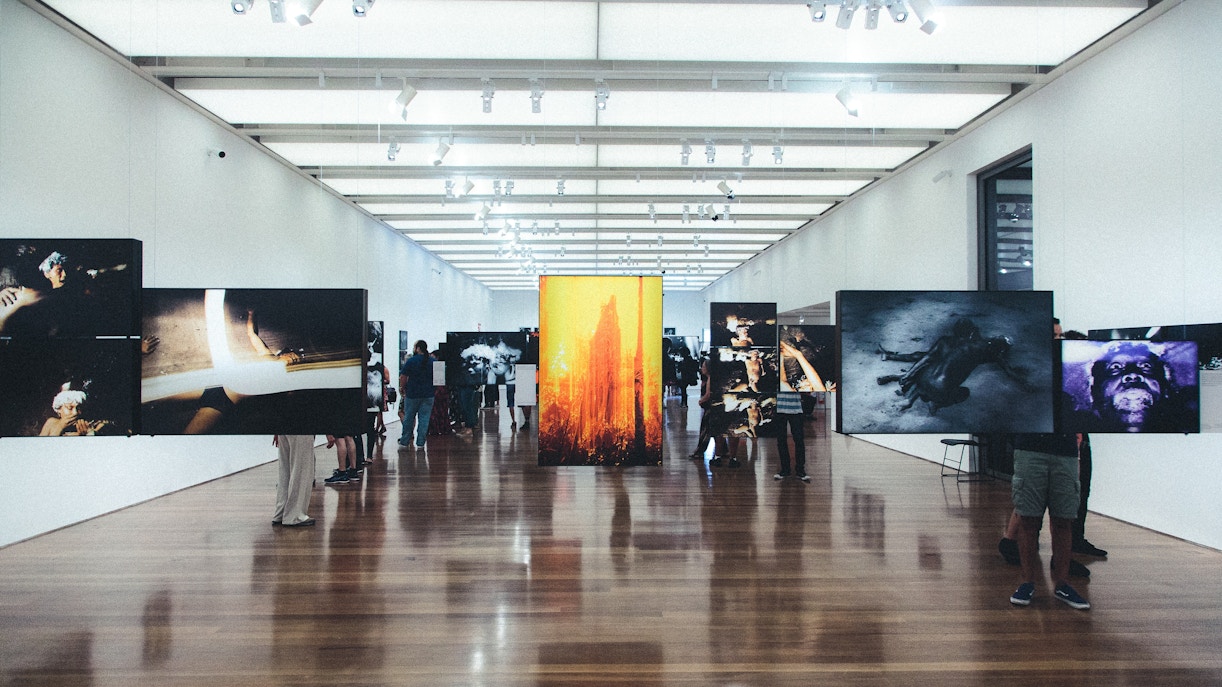 Exhibition hall at MoMA displaying contemporary art pieces.