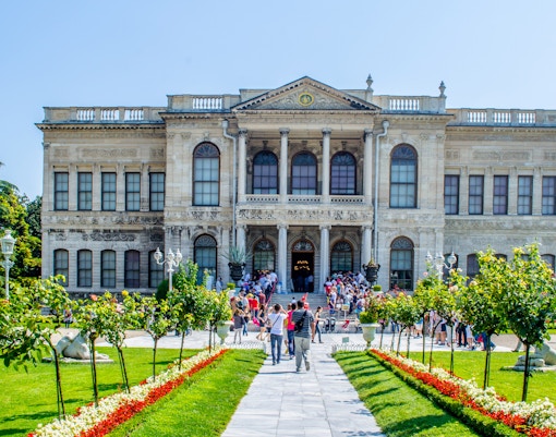Dolmabahce Palace exterior with ornate architecture and Bosphorus view, Istanbul, Turkey.
