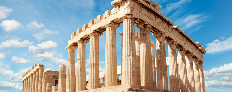 Tourists exploring the ancient ruins of Acropolis with a clear view of Parthenon in Athens, Greece, available with Acropolis & Parthenon Entrance Tickets
