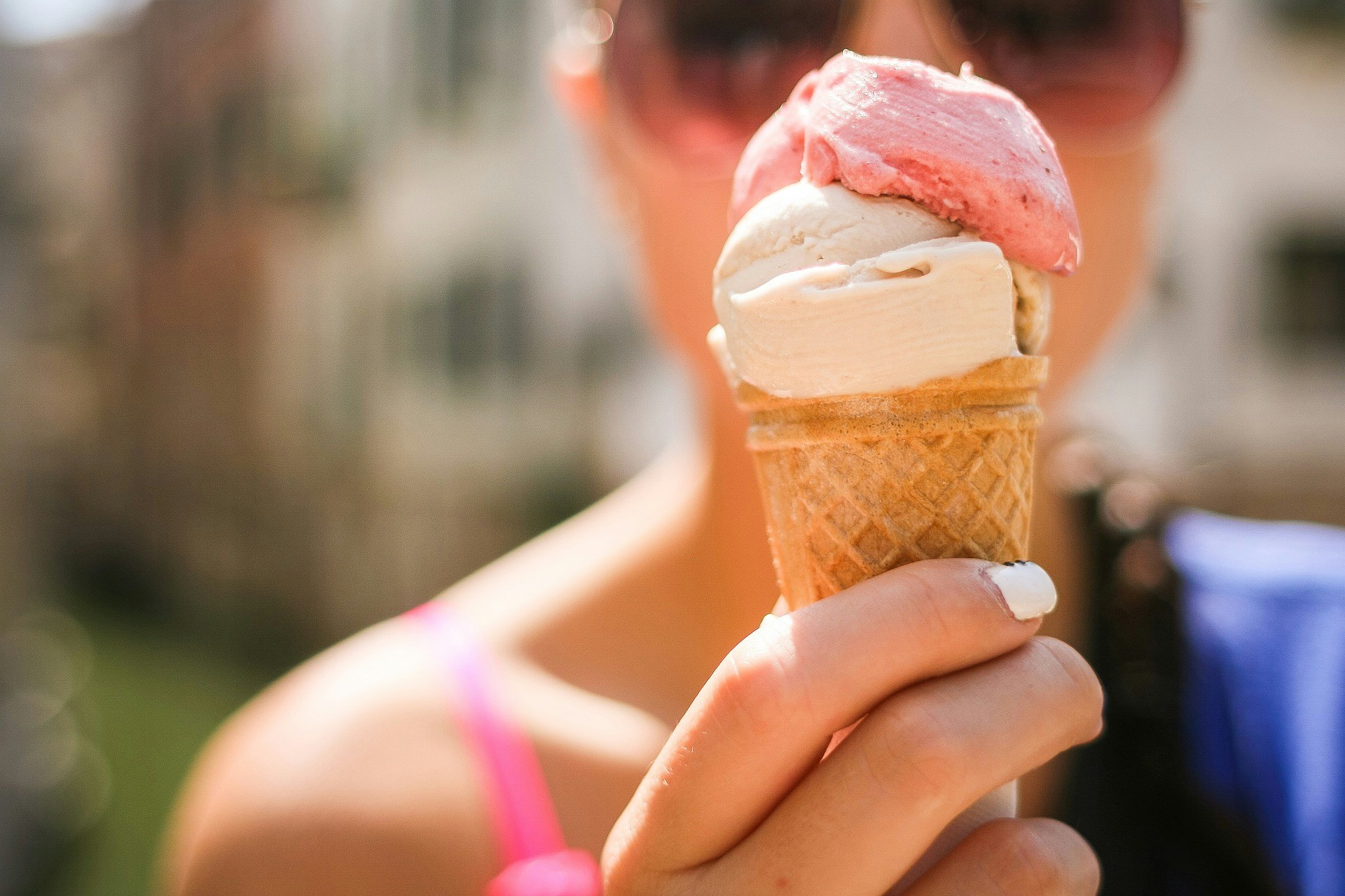 Gelato cone held by a woman visitor