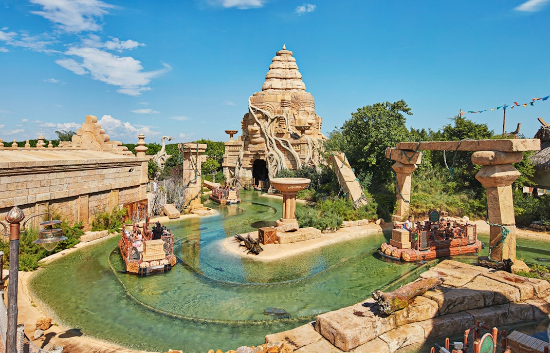 PortAventura Barcelona roller coaster with vibrant loops and thrill-seekers enjoying the ride.