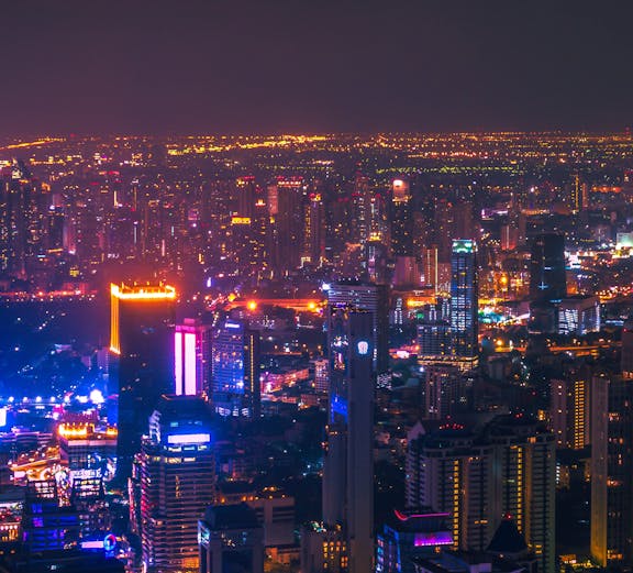 Traditional Thai dancers performing on stage in Bangkok, Thailand.