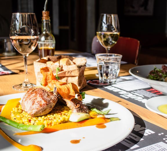 Paris culinary tour featuring local chefs preparing traditional French dishes.