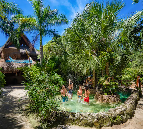 Xplor Park zip-lining adventure in Cancun, Mexico, showcasing lush jungle scenery.