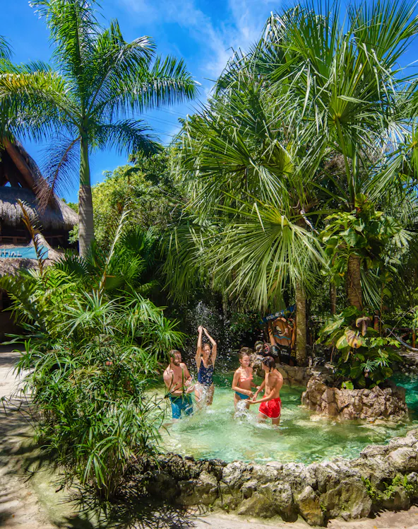 Xplor Park zip-lining adventure in Cancun, Mexico, showcasing lush jungle scenery.