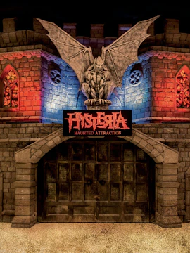 Hysteria Haunted Attraction entrance with gargoyle statue in Dubai.