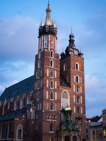 St. Mary's Basilica in Krakow with its iconic twin towers at dusk.