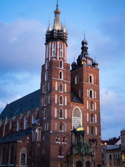 St. Mary's Basilica in Krakow with its iconic twin towers at dusk.