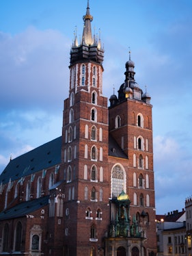 St. Mary's Basilica in Krakow with its iconic twin towers at dusk.