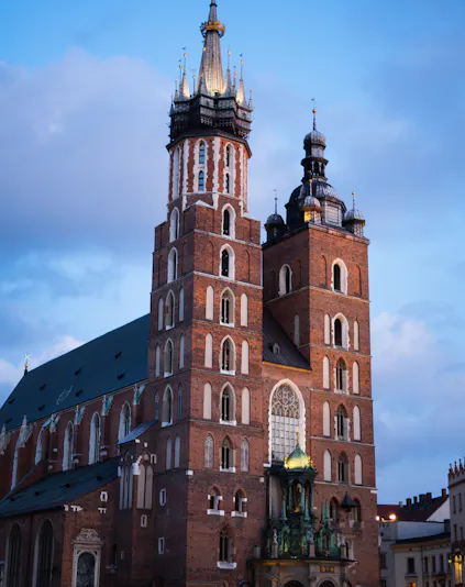 St. Mary's Basilica in Krakow with its iconic twin towers at dusk.