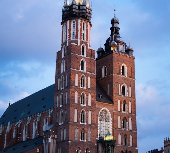 St. Mary's Basilica in Krakow with its iconic twin towers at dusk.